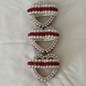 Six Red and White Pearl Heart Napkin Rings
